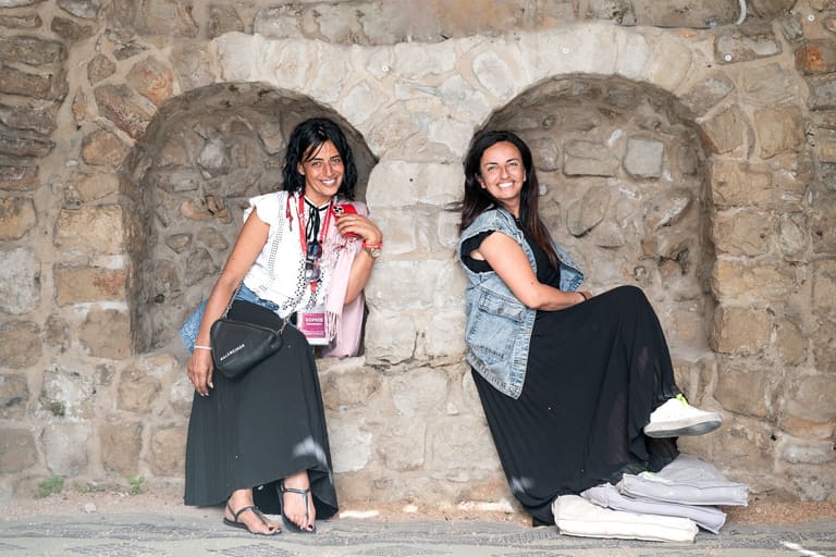 Two friends resting in the stone archways of the Tzfat Old City