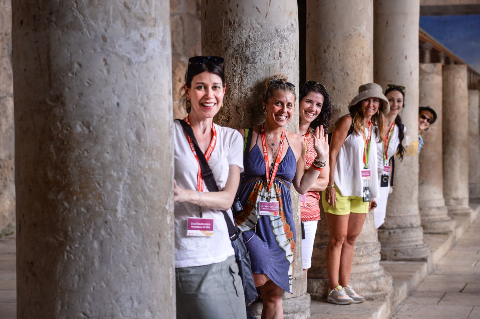 Momentum participants smiling between the pillars in Israel